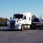 Loaded steel coil on PGT Trucking truck and trailer