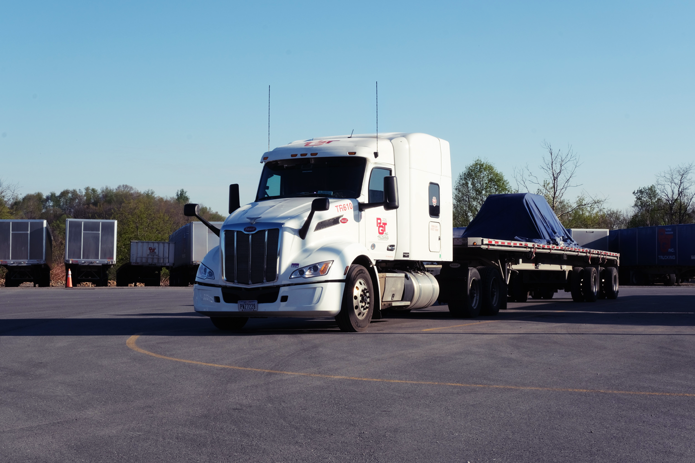 Loaded steel coil on PGT Trucking truck and trailer